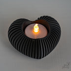 black heart candle holder with sculptural ribbed design