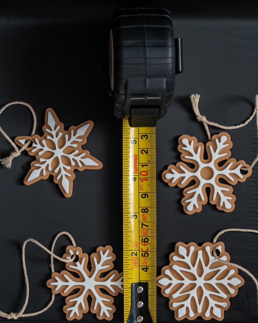 Snowflake ornament set next to measuring tape for scale