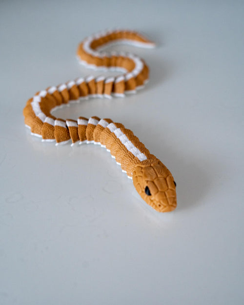 Articulated snake figure with flexible segmented body design