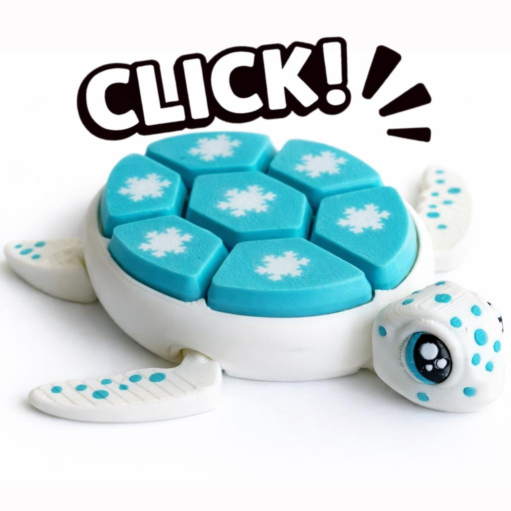 Snowflake turtle clicker close-up with blue shell details and articulated design