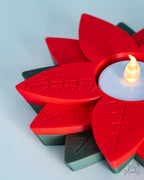 red poinsettia candle holder