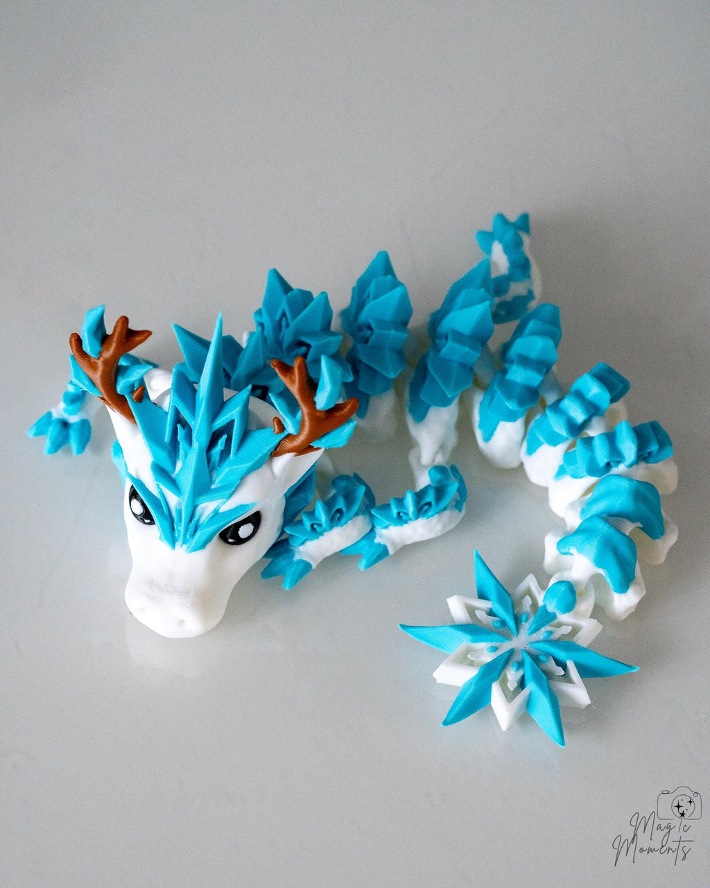 Ice dragon articulated figure with snowflake and antler details