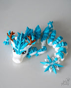 Ice dragon articulated figure with snowflake and antler details