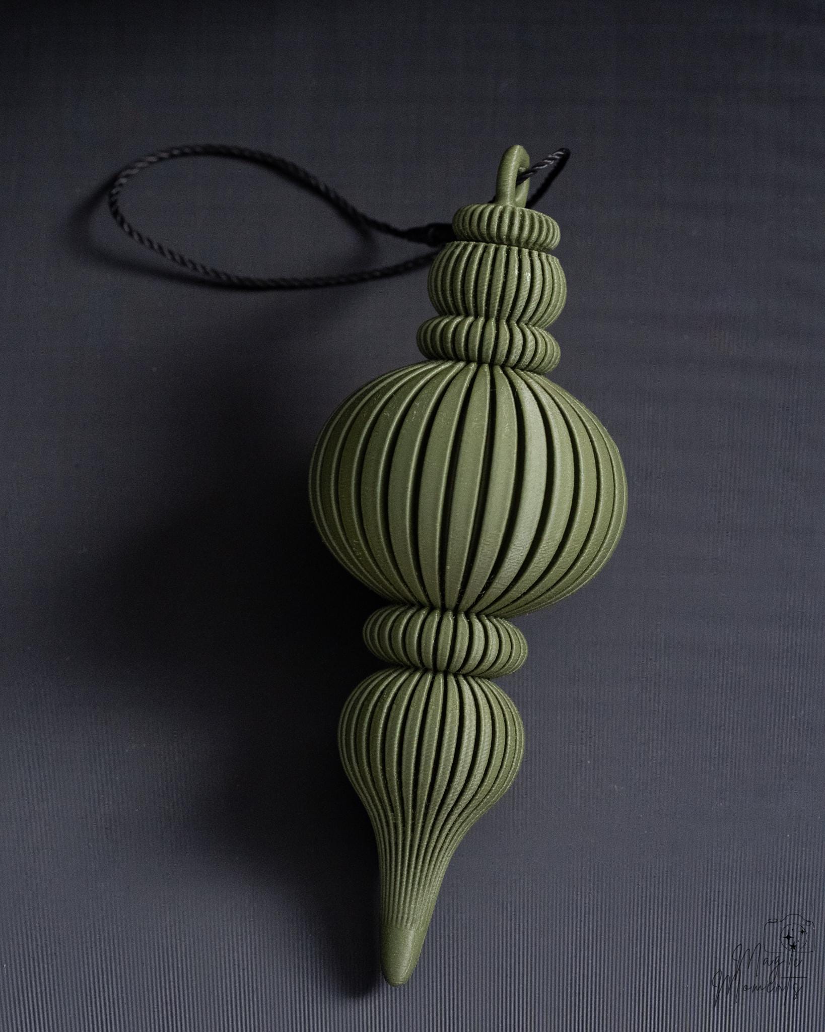Green Christmas bauble ornament with modern ribbed design
