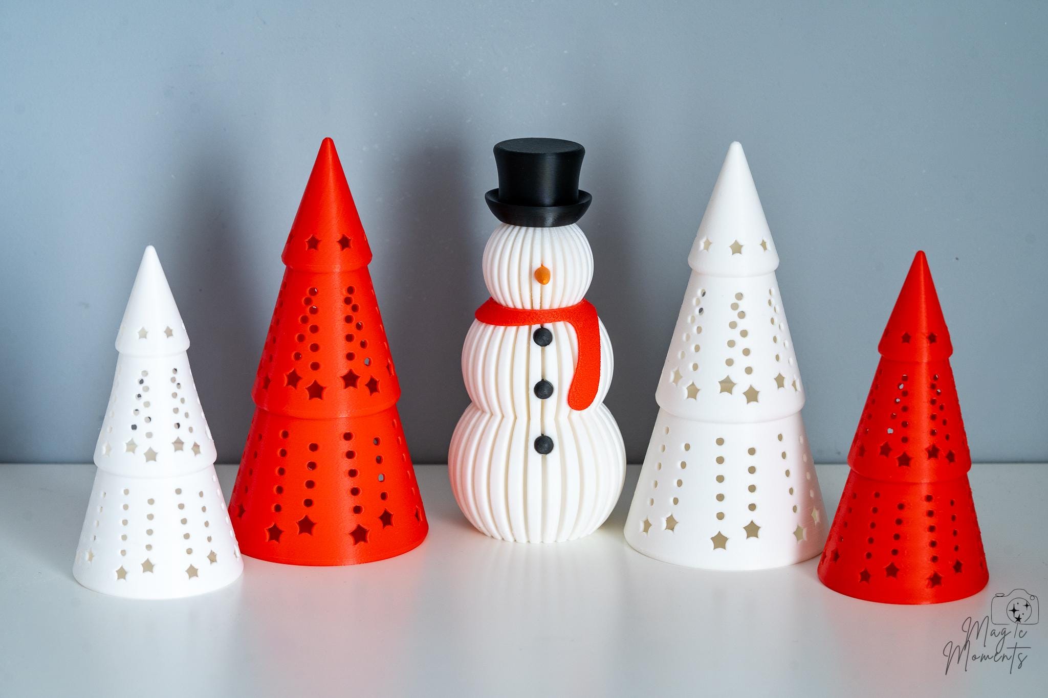 3D printed Christmas tree and snowman decorations in festive colours