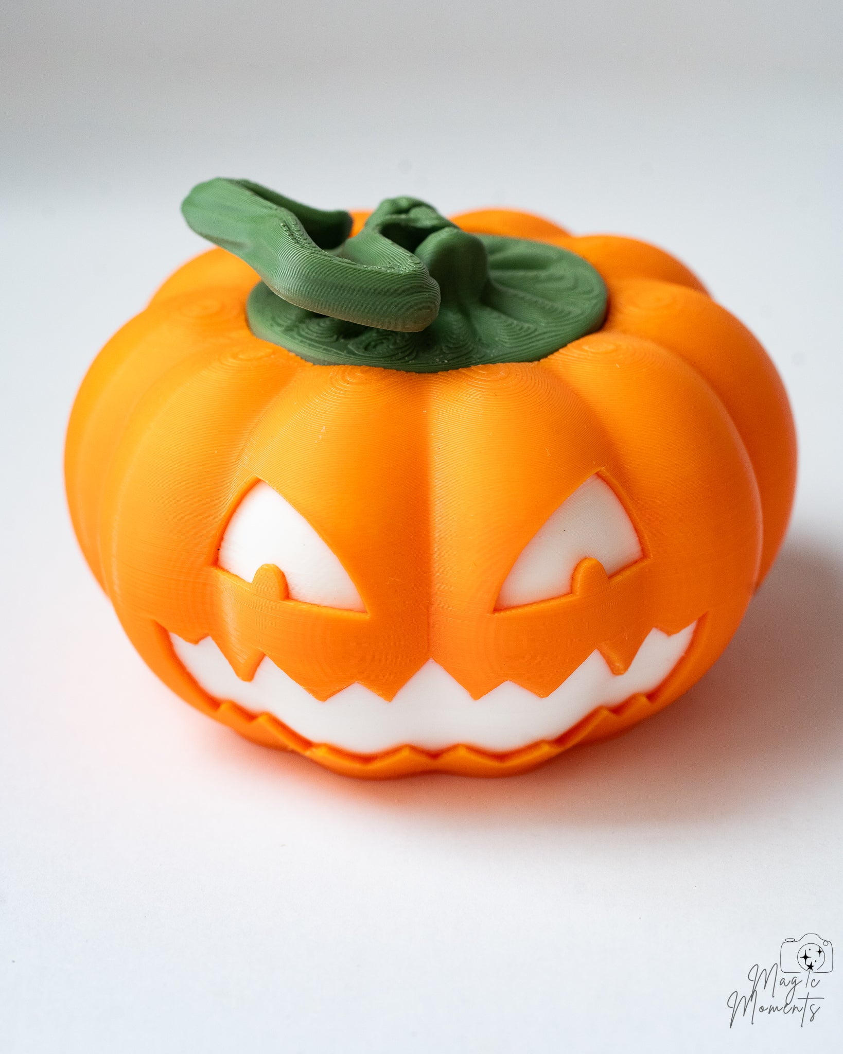 3D printed pumpkin storage box with removable lid and spooky jack o lantern face for Halloween décor