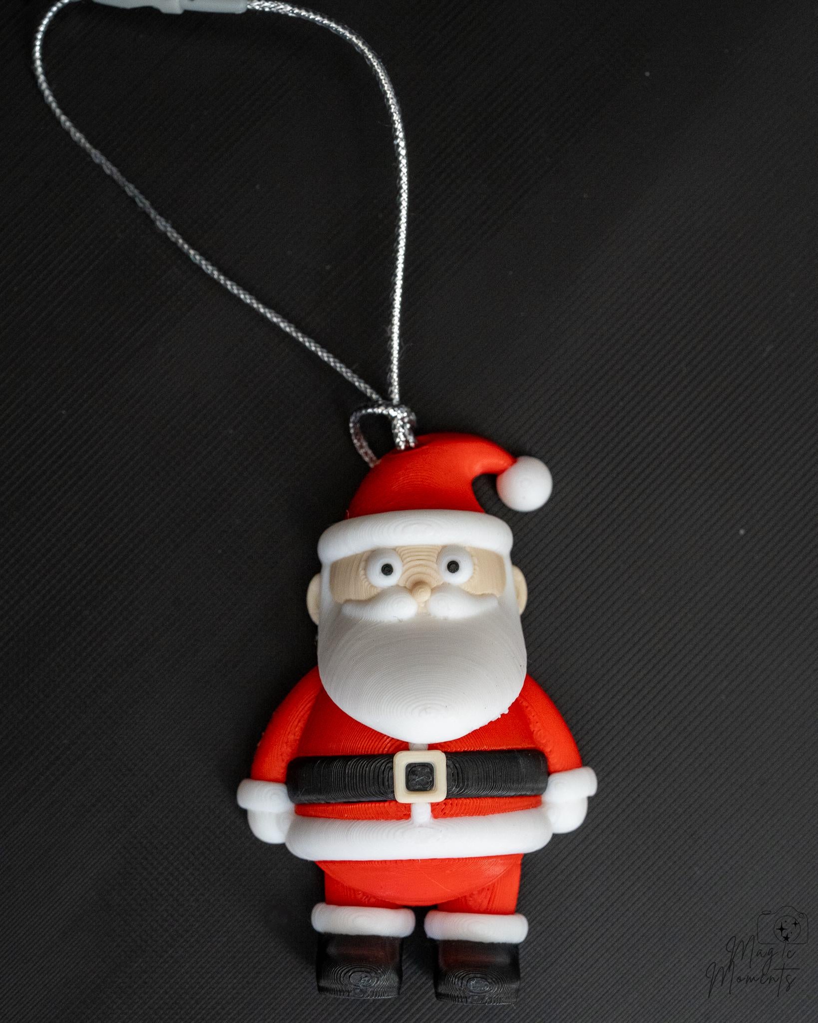 Santa Claus hanging Christmas ornament with festive red outfit