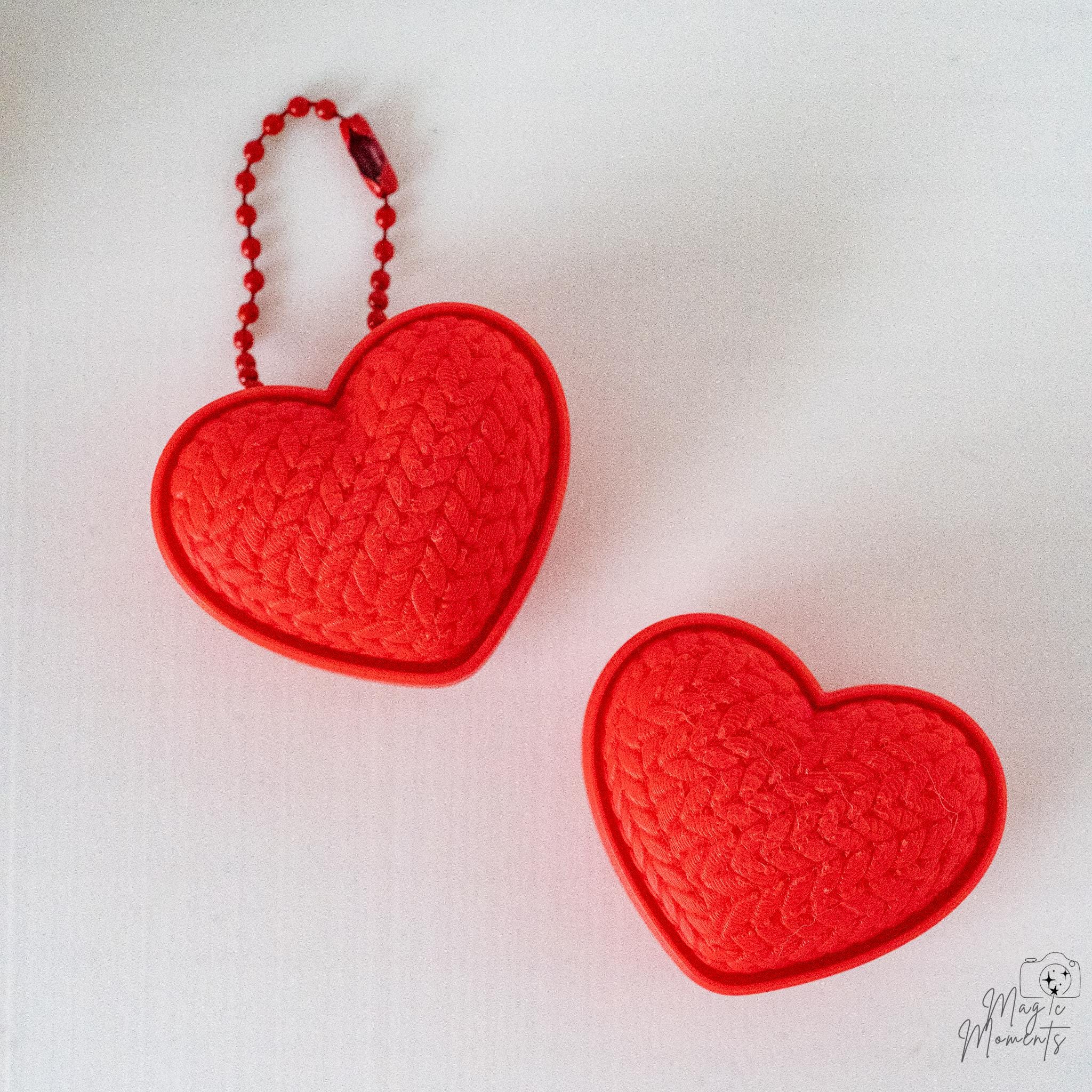 Heart clicker with hanging loop and textured design