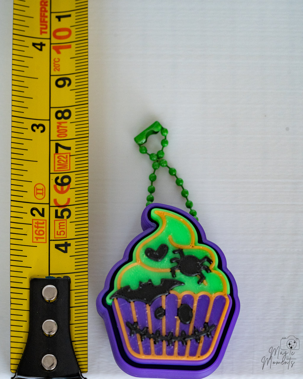 zombie cupcake clicker next to measuring tape for scale