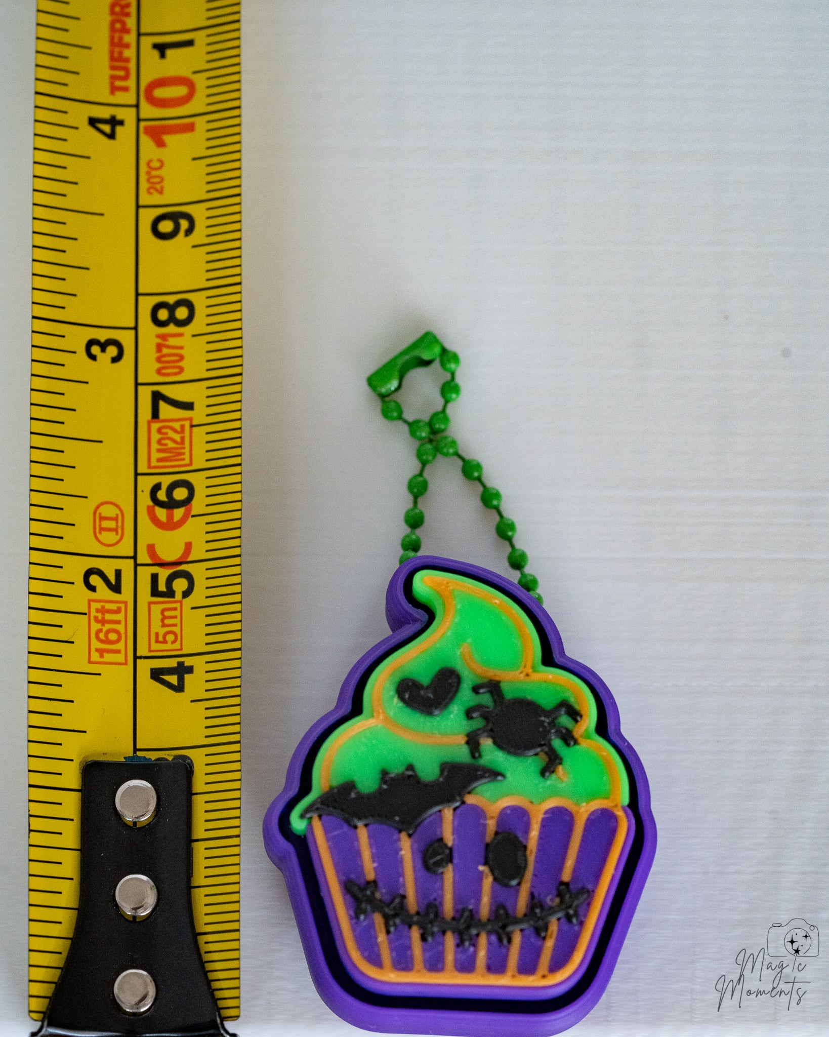 zombie cupcake clicker next to measuring tape for scale