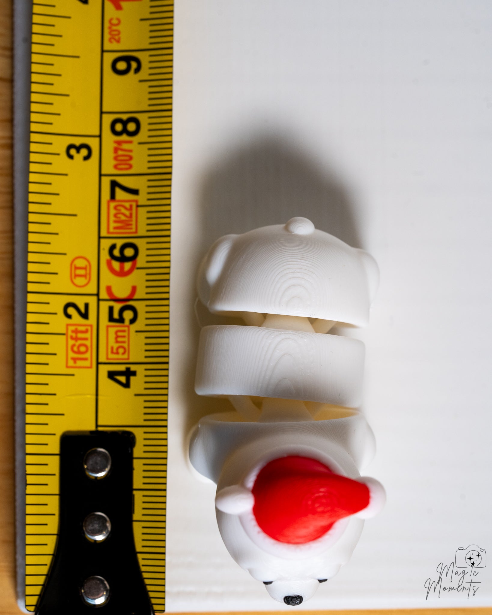 polar bear next to measuring tape for scale