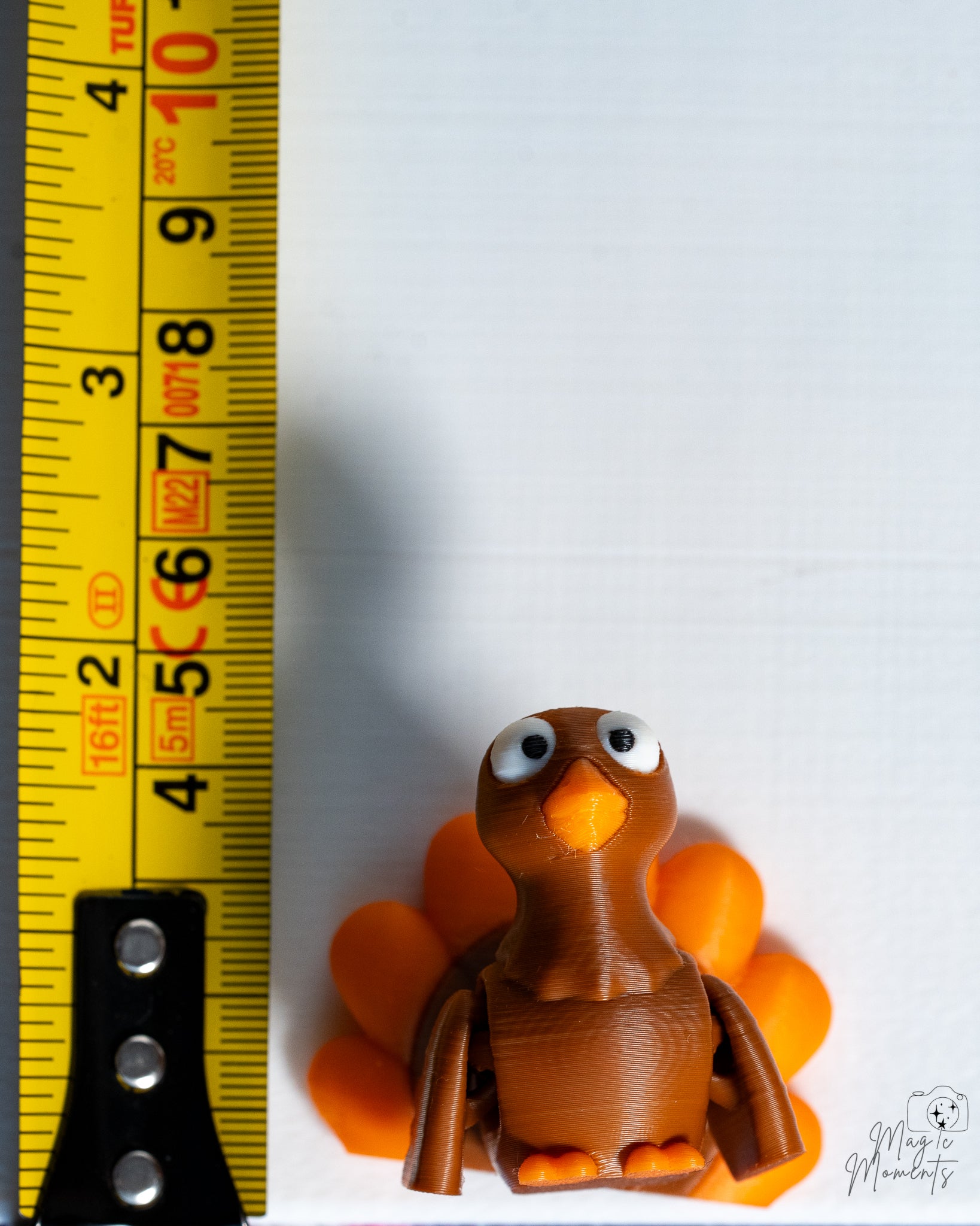 turkey figurine next to measuring tape for scale