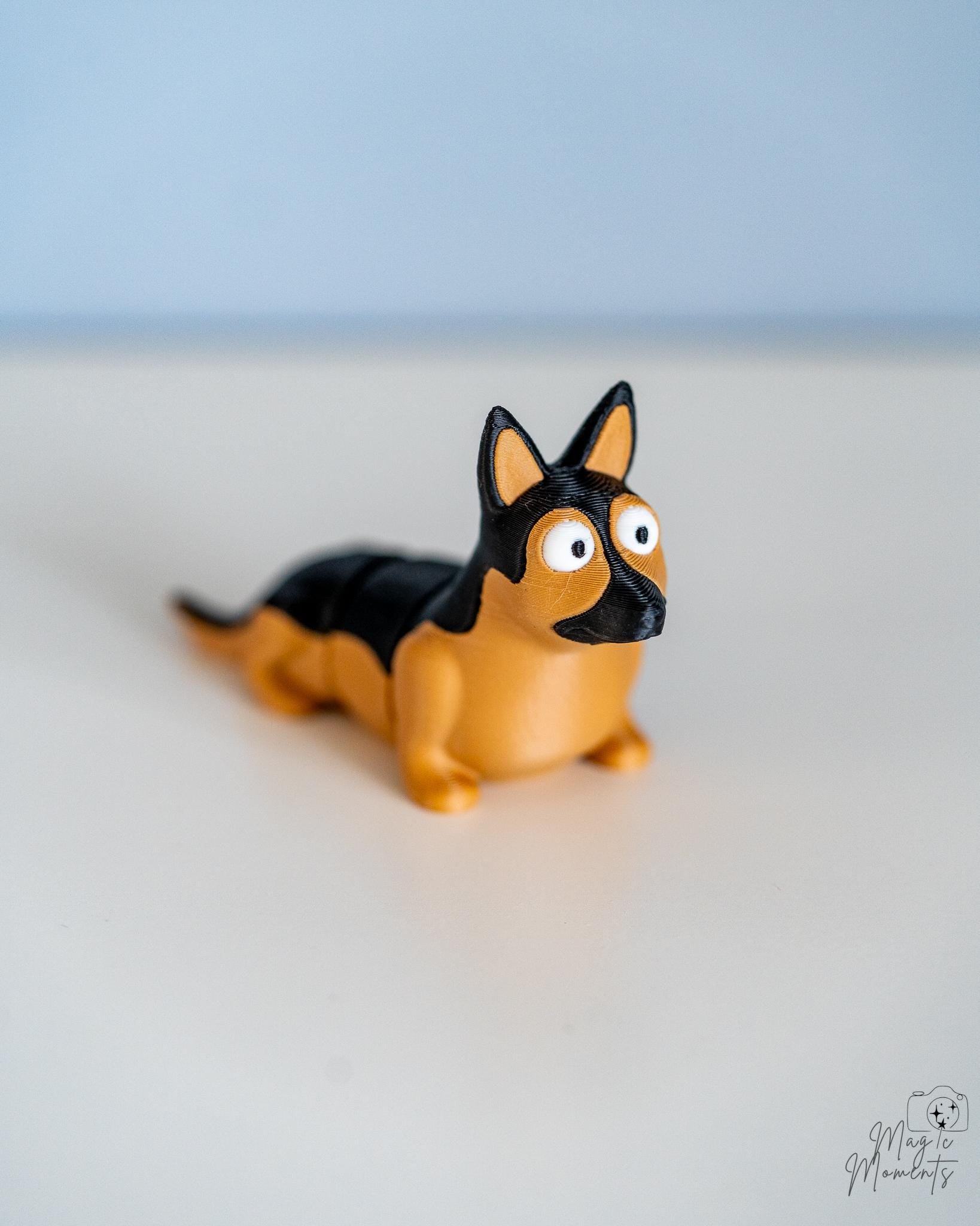 German shepherd style dog figure with black and tan colouring