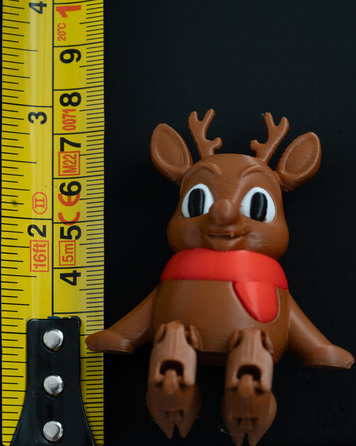Reindeer shelf sitter next to measuring tape for scale