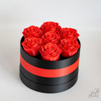 Black and red flower box with decorative roses