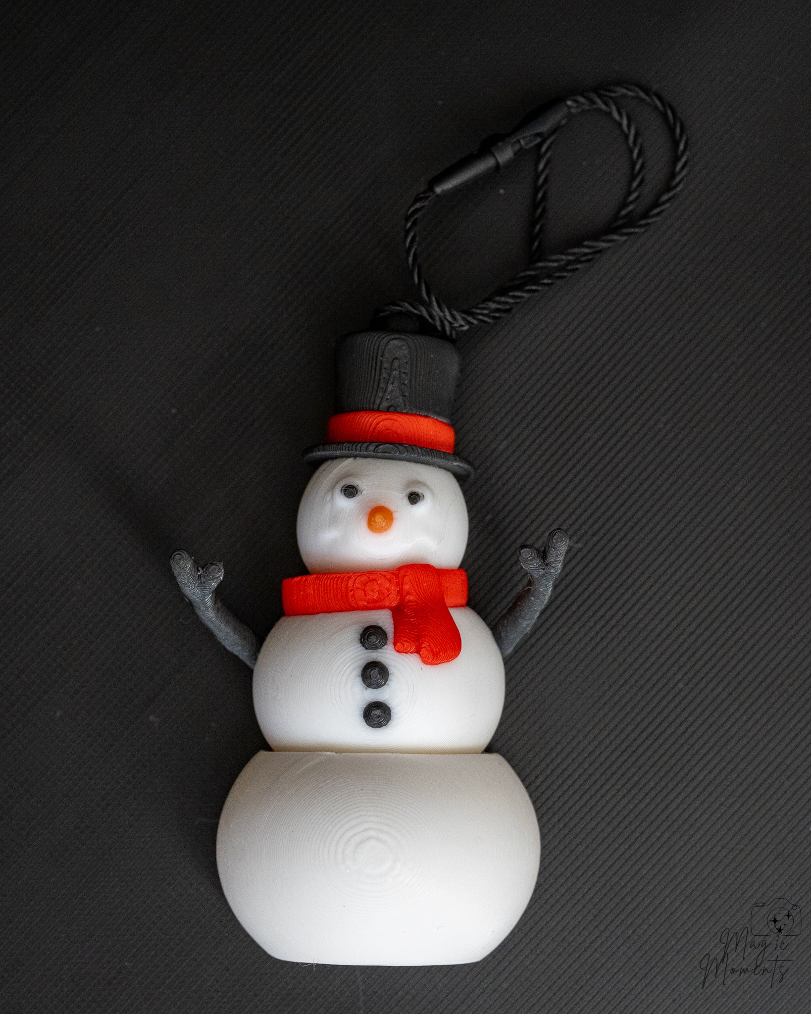 Snowman Christmas ornament with black hat and red scarf