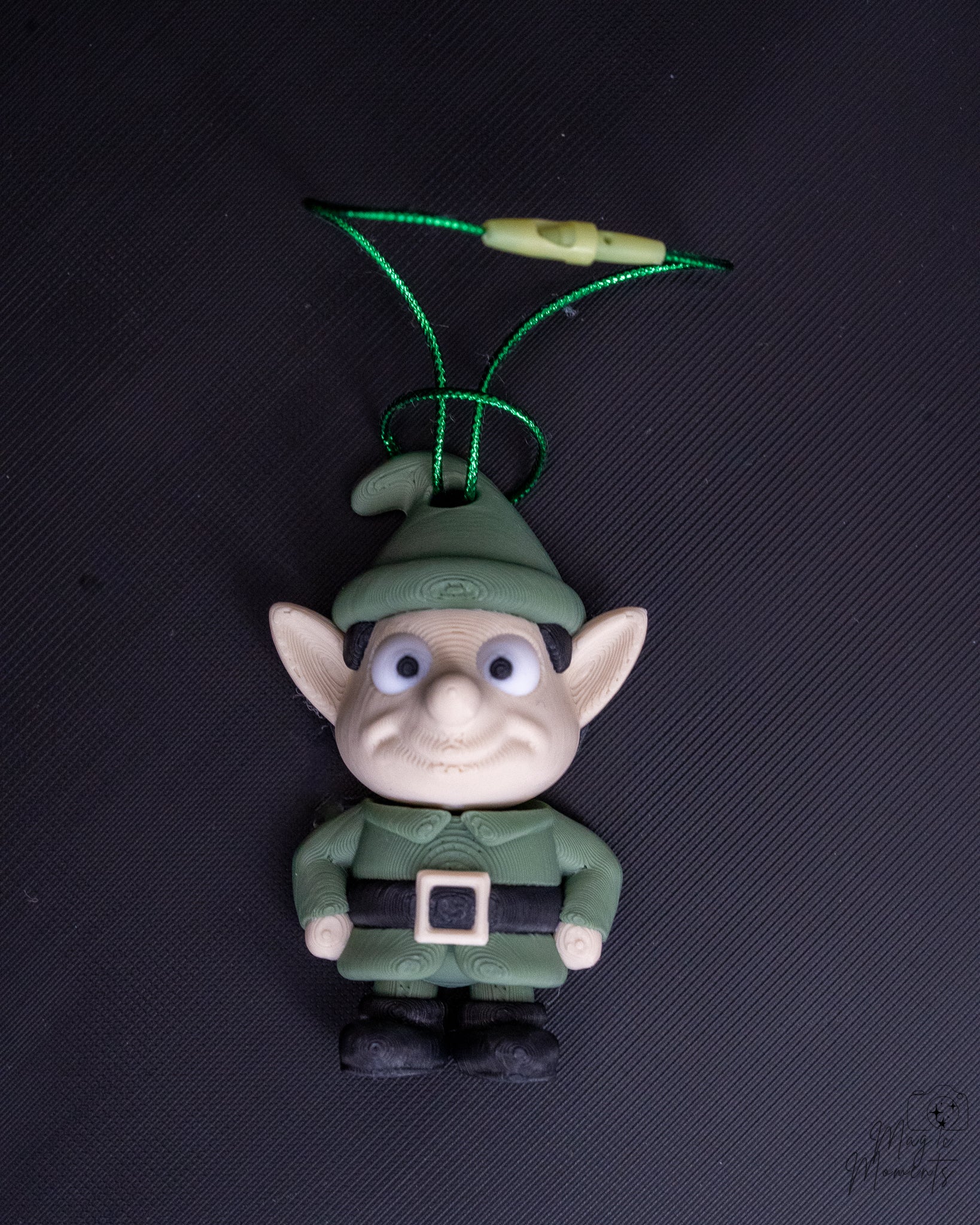 Elf Christmas ornament with green outfit and pointed ears