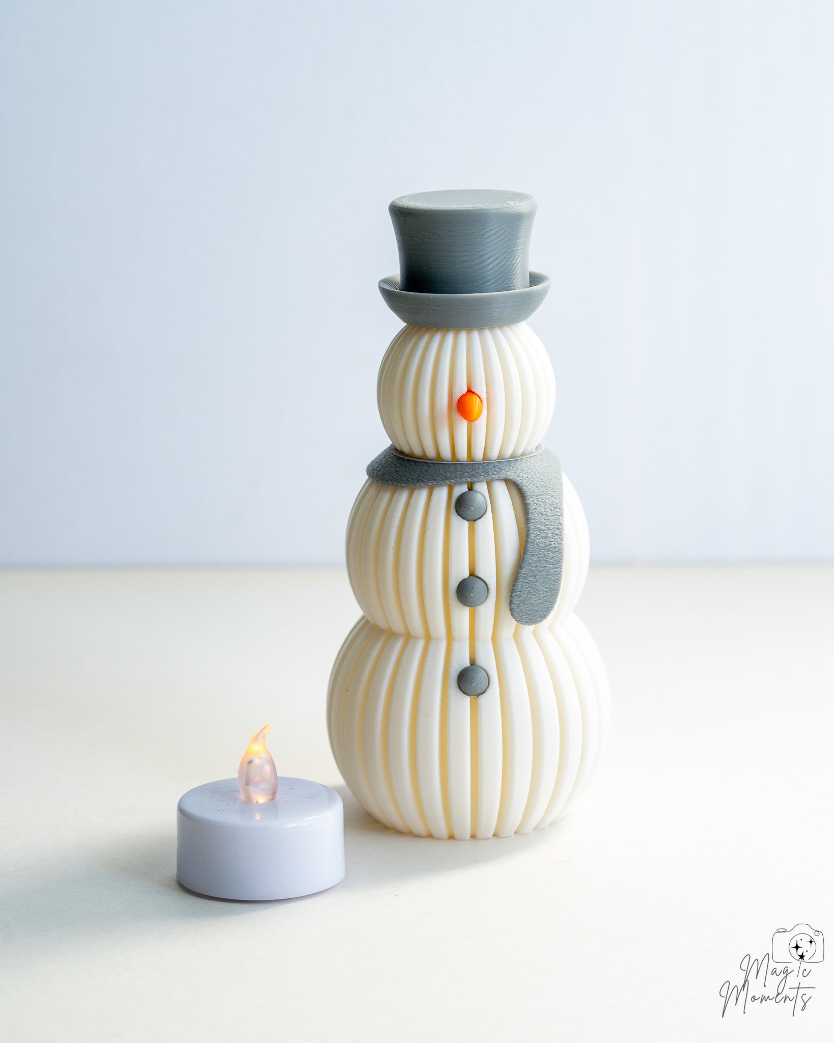 Grey scarf snowman decoration with LED tealight display