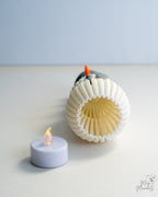 Bottom view of snowman decoration showing hollow ribbed interior design