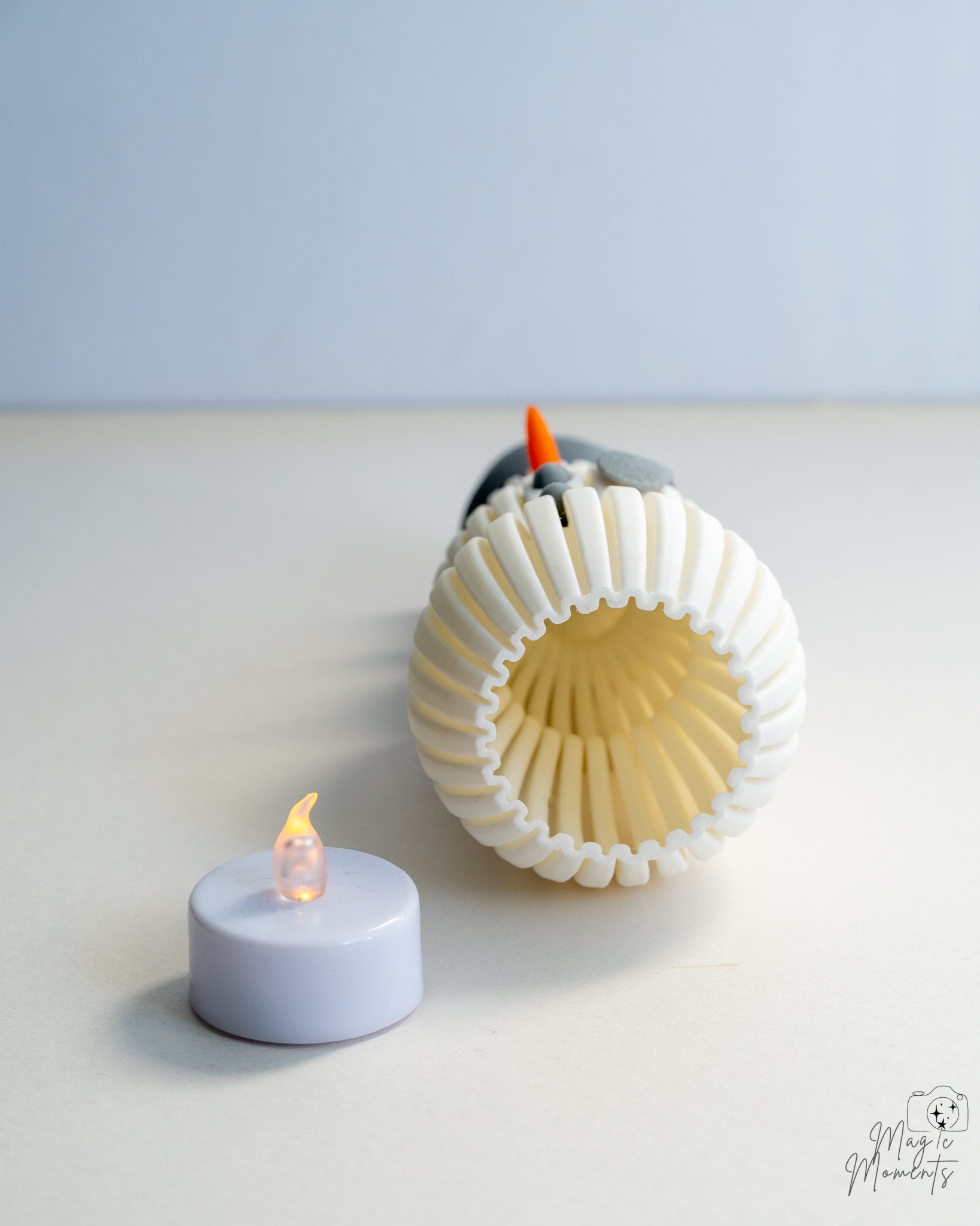Bottom view of snowman decoration showing hollow ribbed interior design