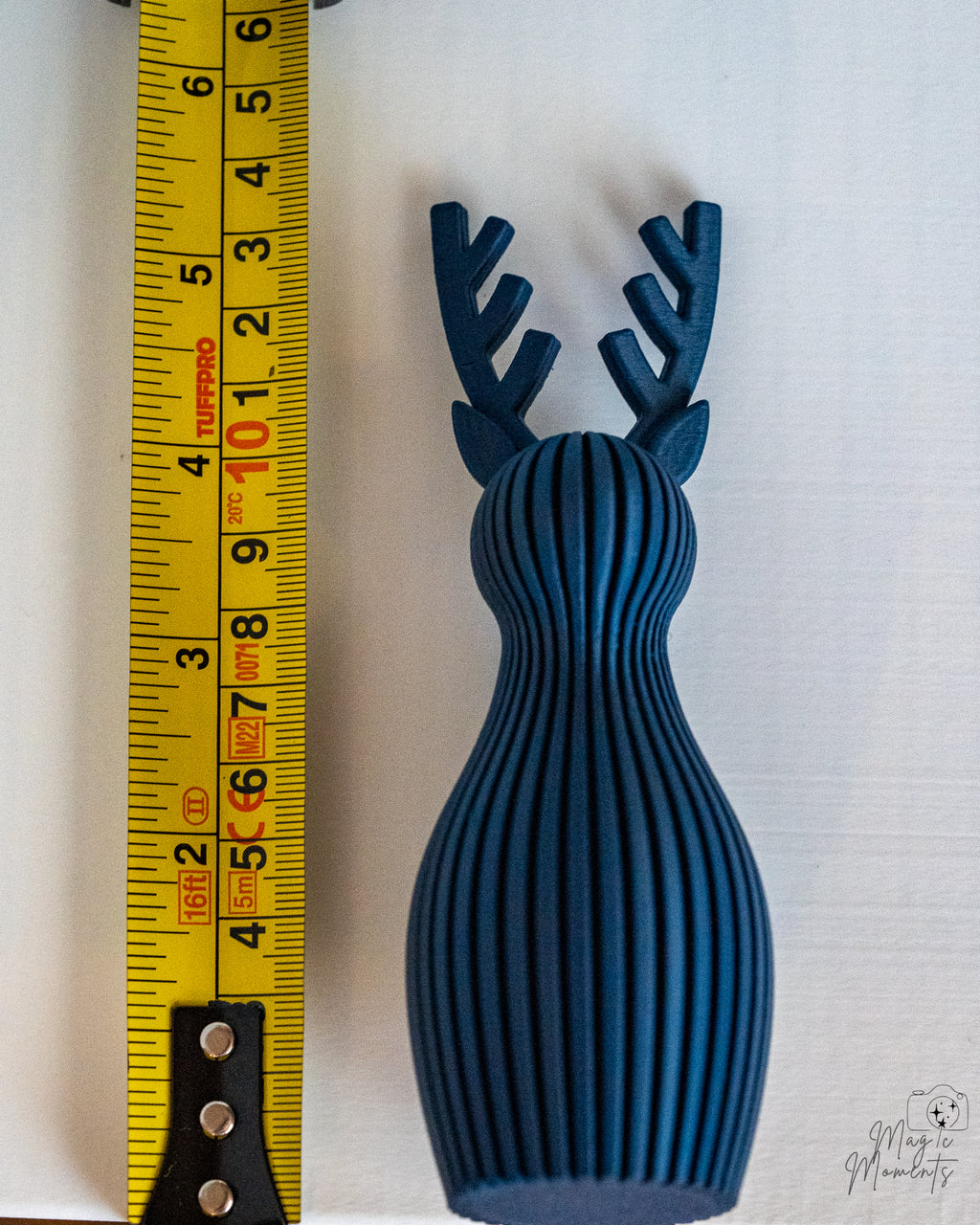 reindeer decor next to measuring tape for scale