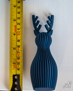reindeer decor next to measuring tape for scale