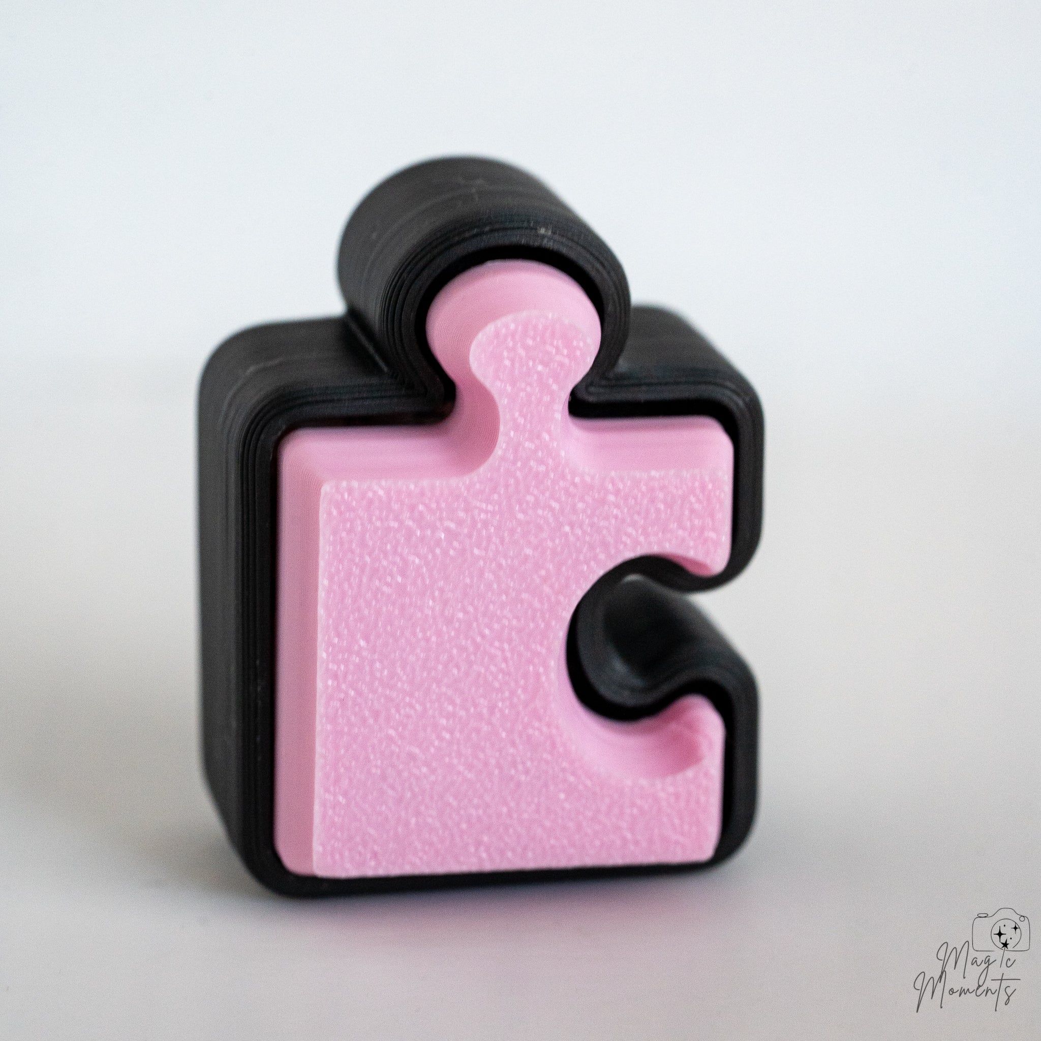 pink puzzle piece fidget clicker