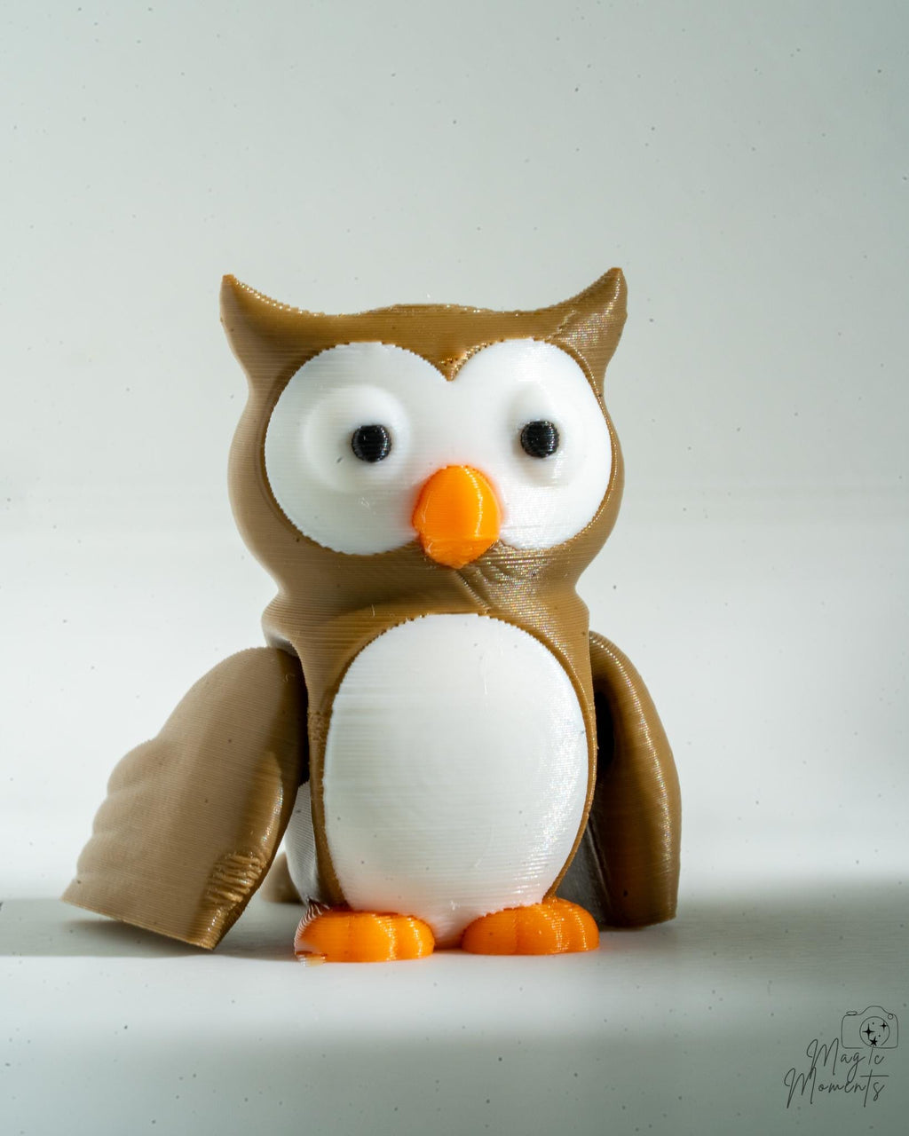 3D-printed owl figurine on a white background