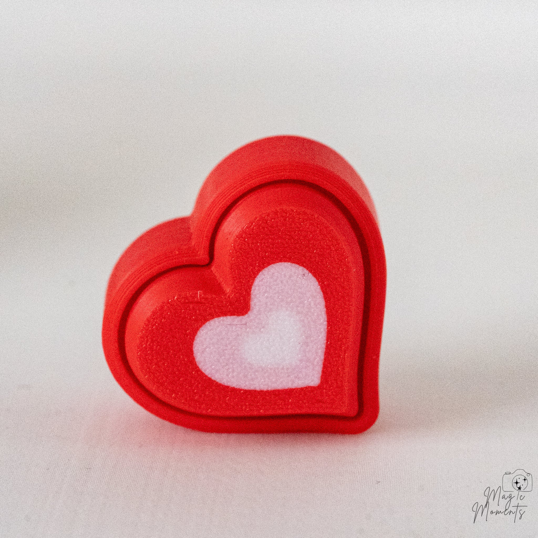 Heart clicker with layered pink and white heart design
