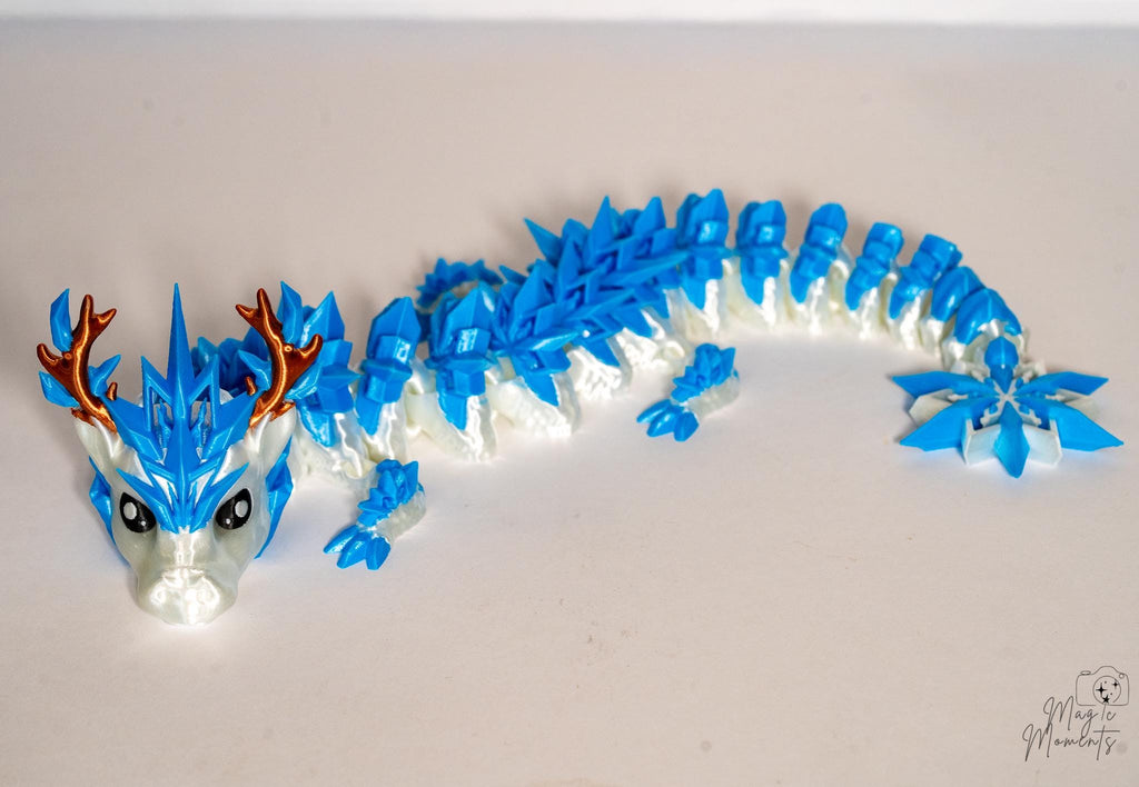 Ice dragon figure with snowflake tail detail and articulated movement