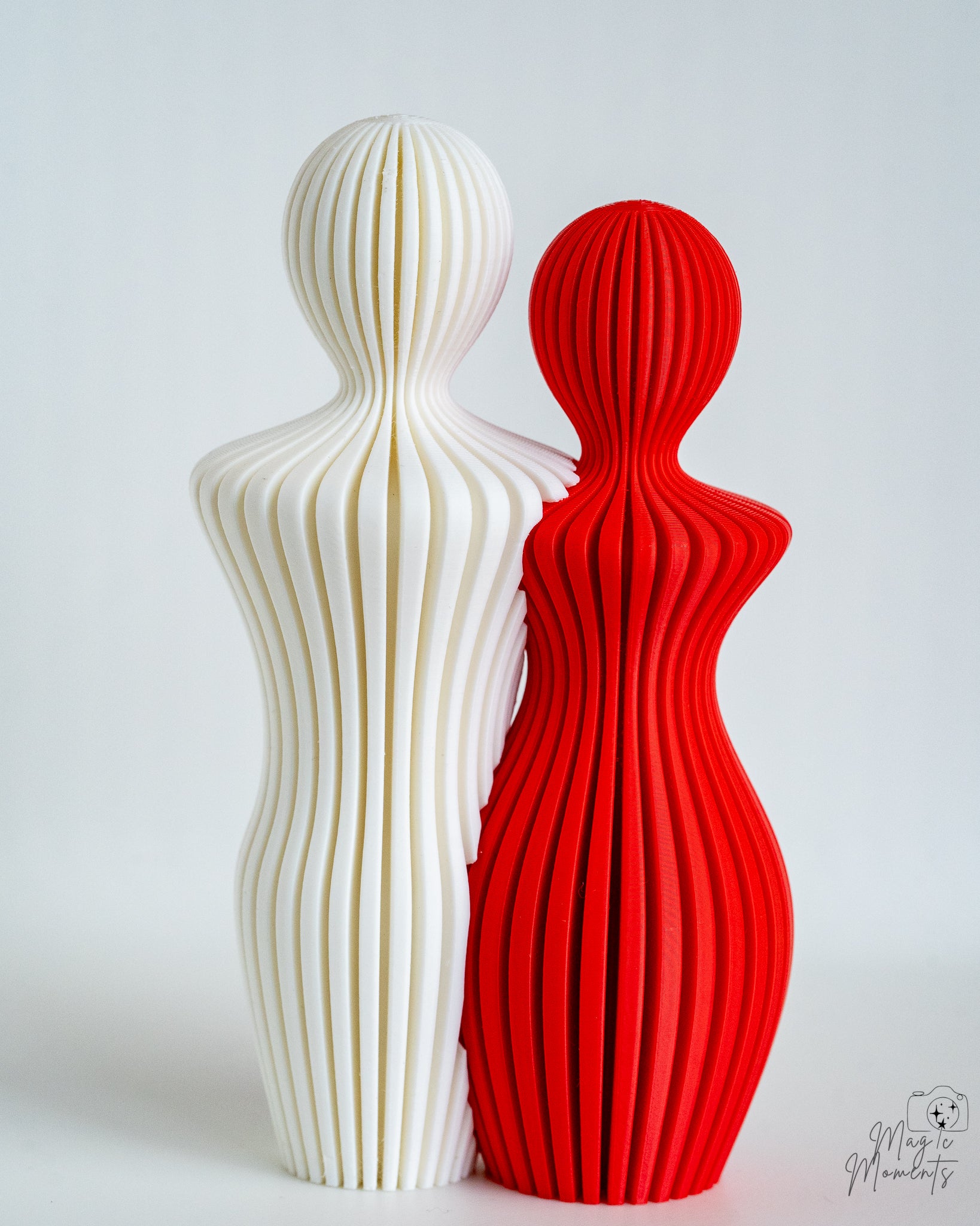 White and red abstract sculpture pair with modern romantic design