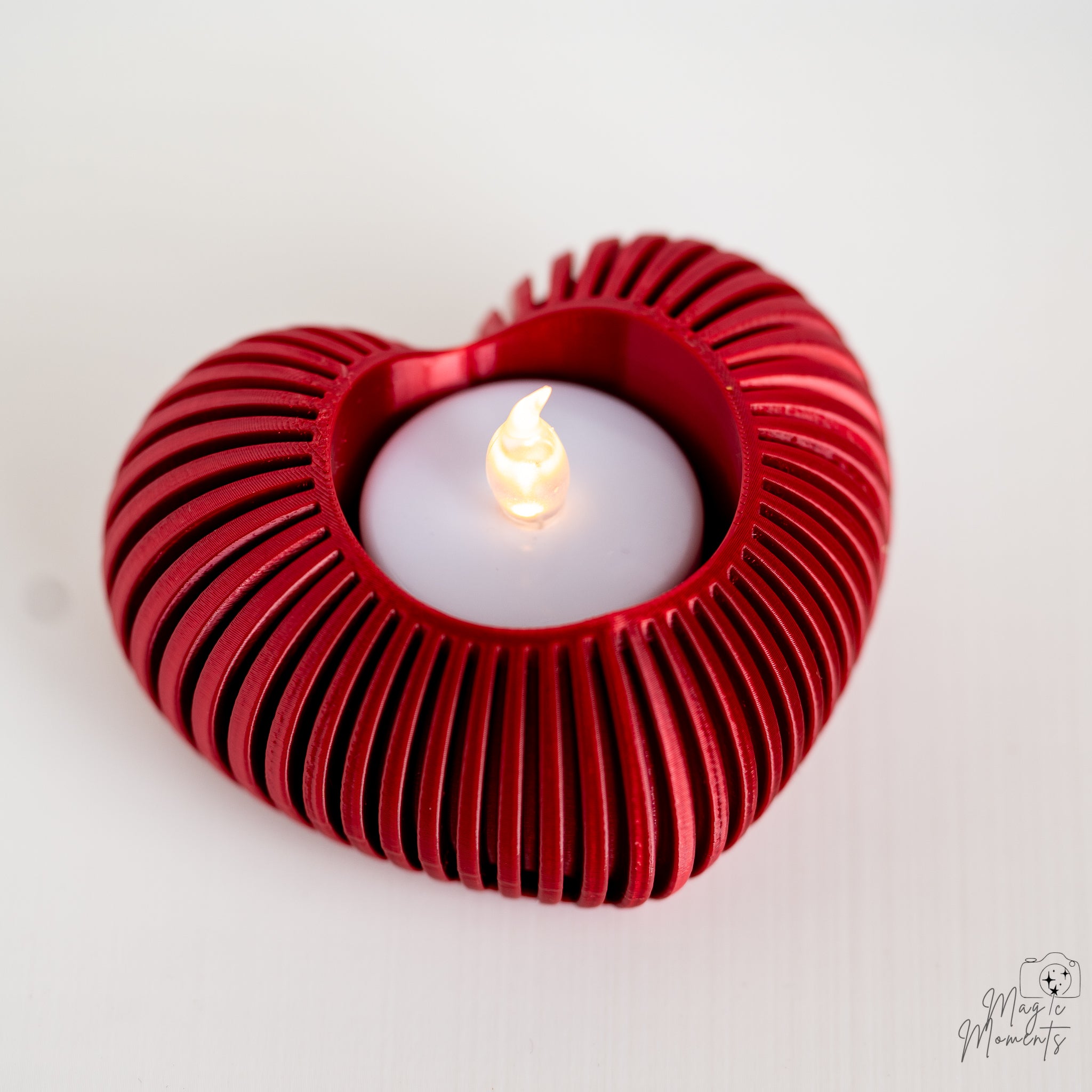 Red heart tealight holder with bold ribbed texture pattern