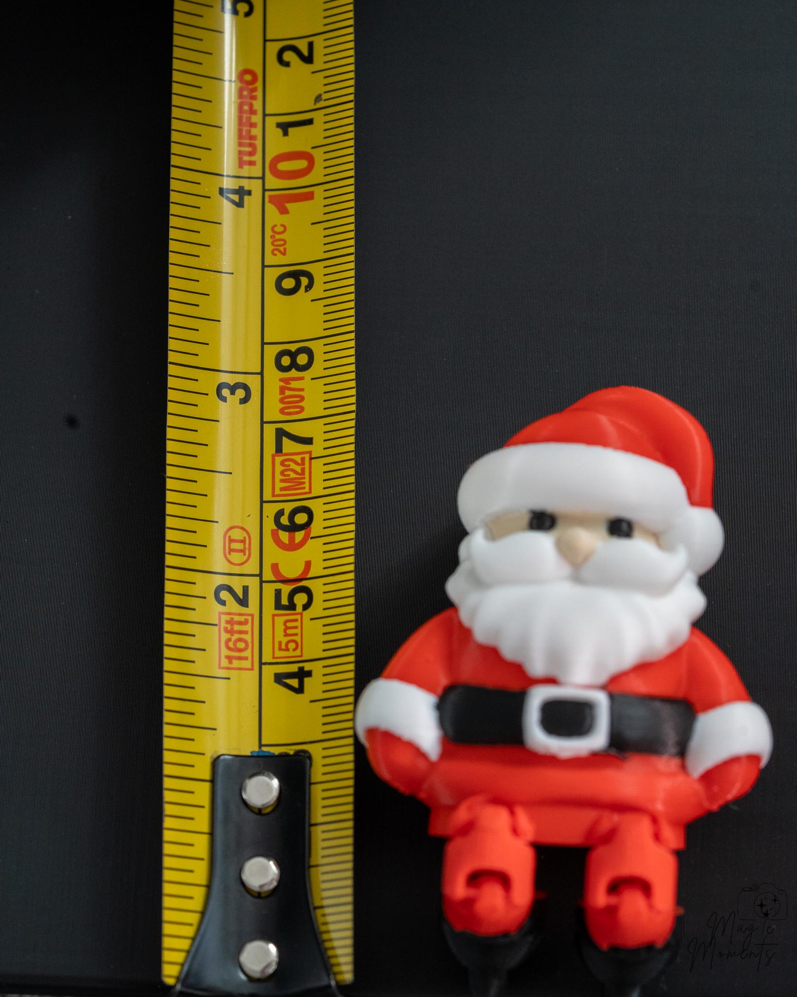 mini santa claus christmas figure next to measuring tape for scale
