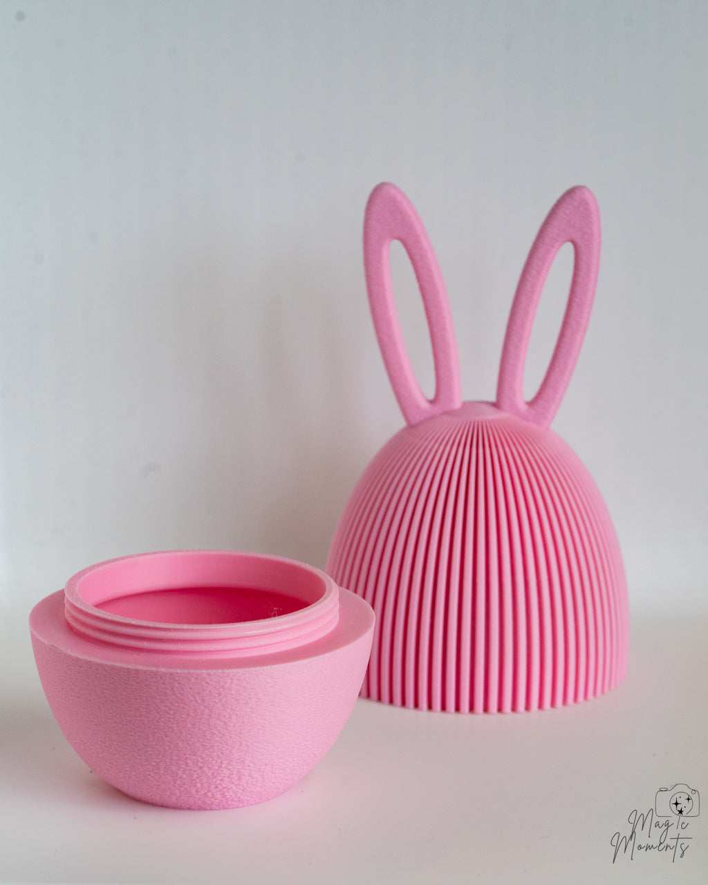 Pink ribbed Easter egg container with rabbit ears