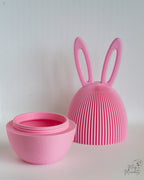 Pink ribbed Easter egg container with rabbit ears