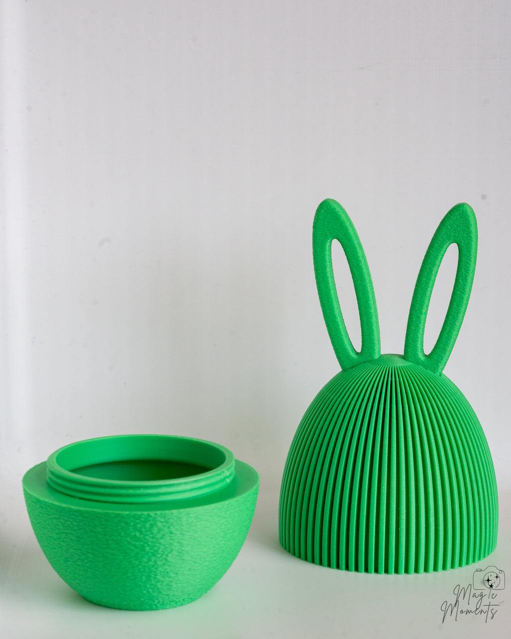 Green bunny egg container with hidden storage compartment