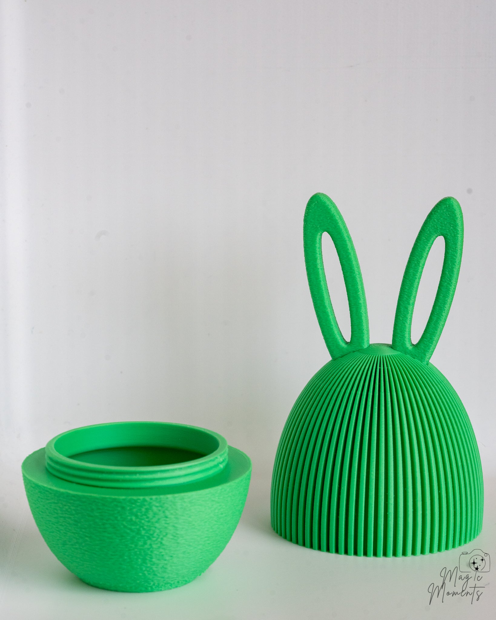 Green bunny egg container with hidden storage compartment