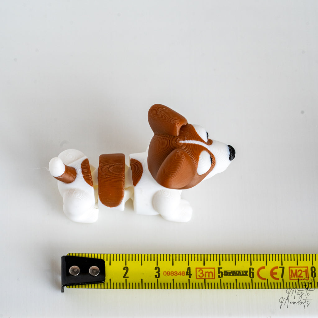 jack russell terrier figure next to measuring tape for scale