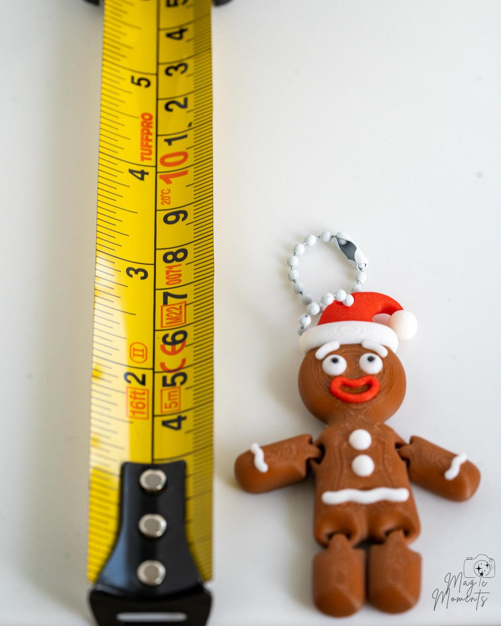 Gingerbread ornament next to measuring tape for scale