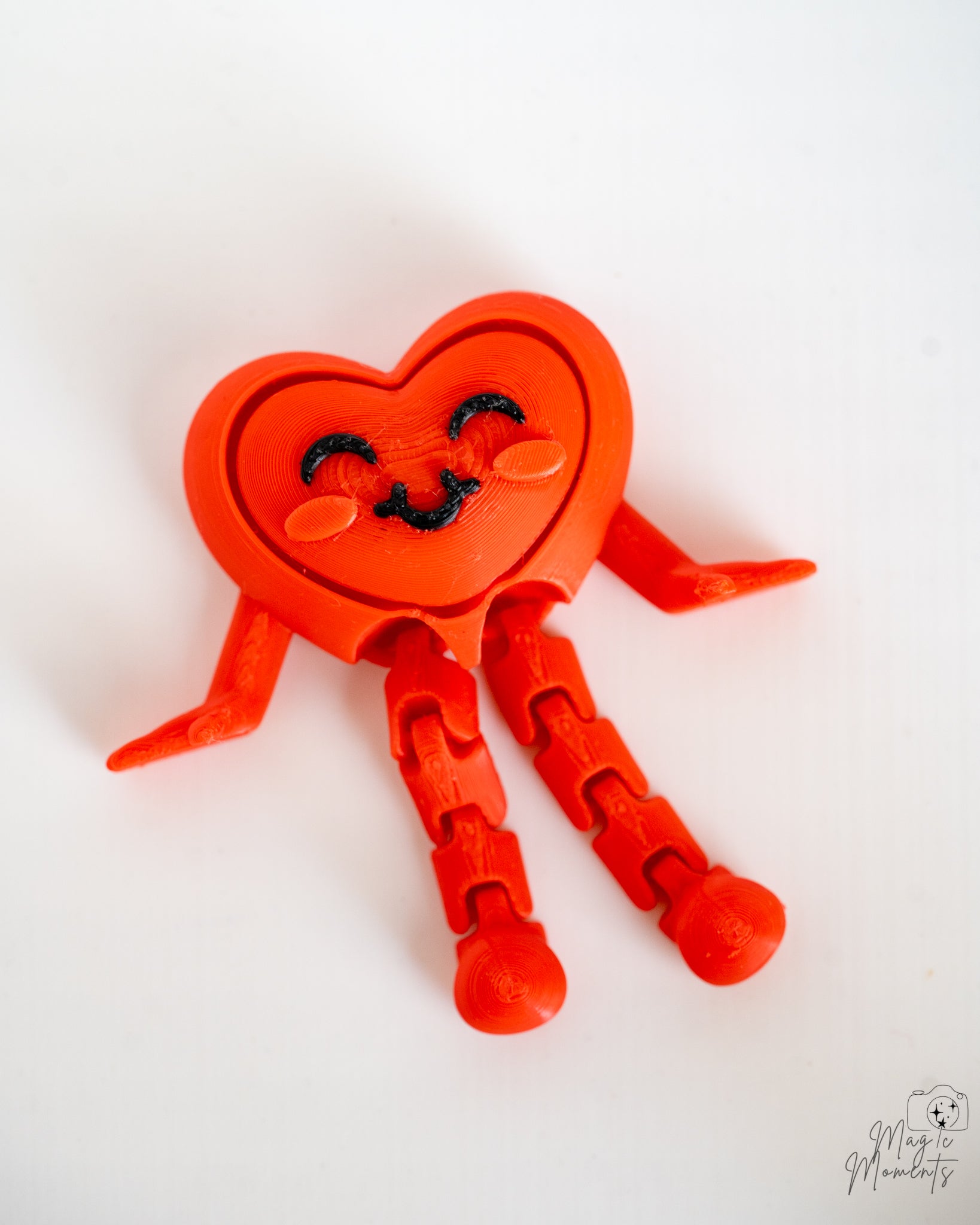 Heart clicker keychain viewed from front