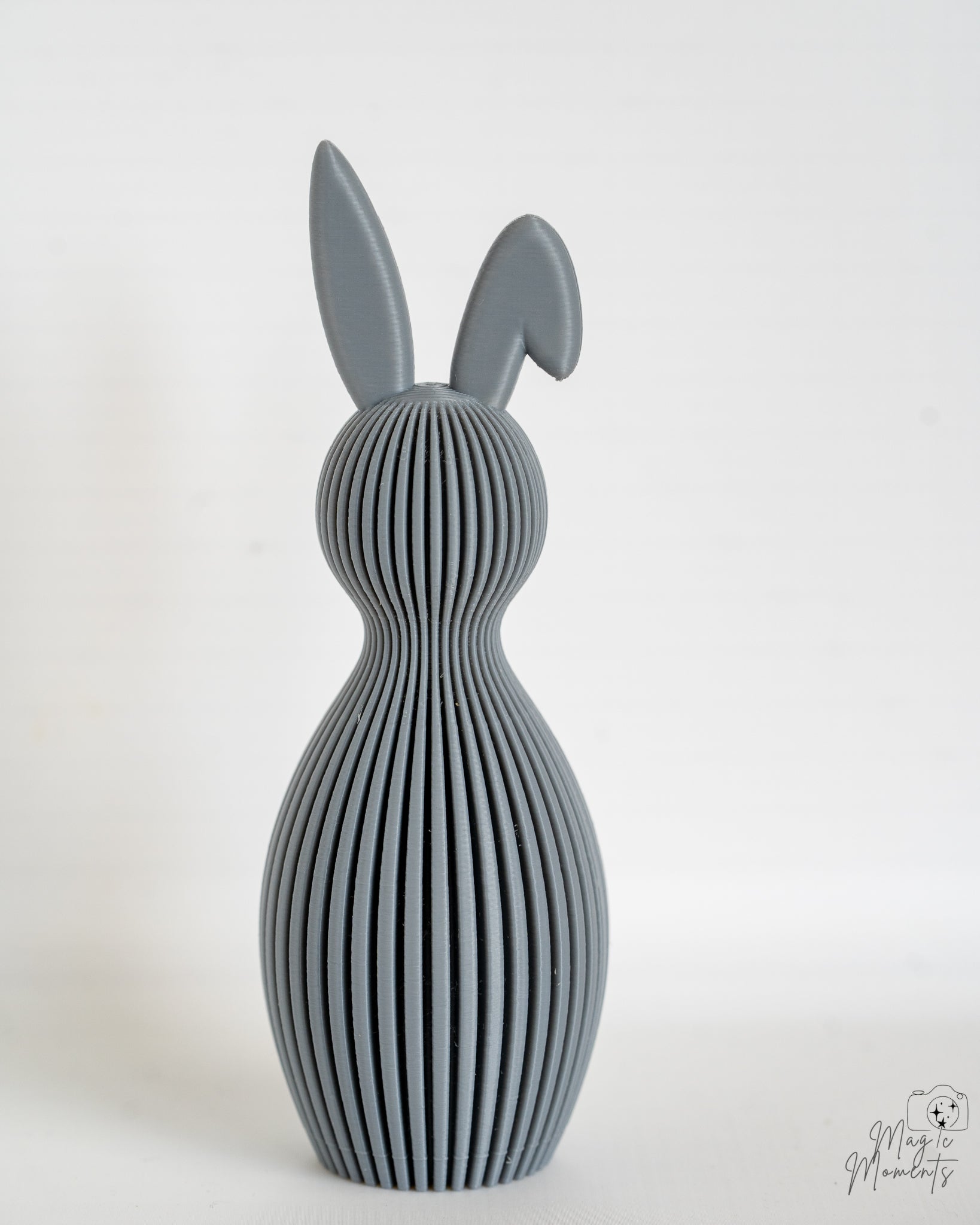 Grey ribbed bunny figure with folded ears