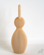 Beige bunny figure viewed from side