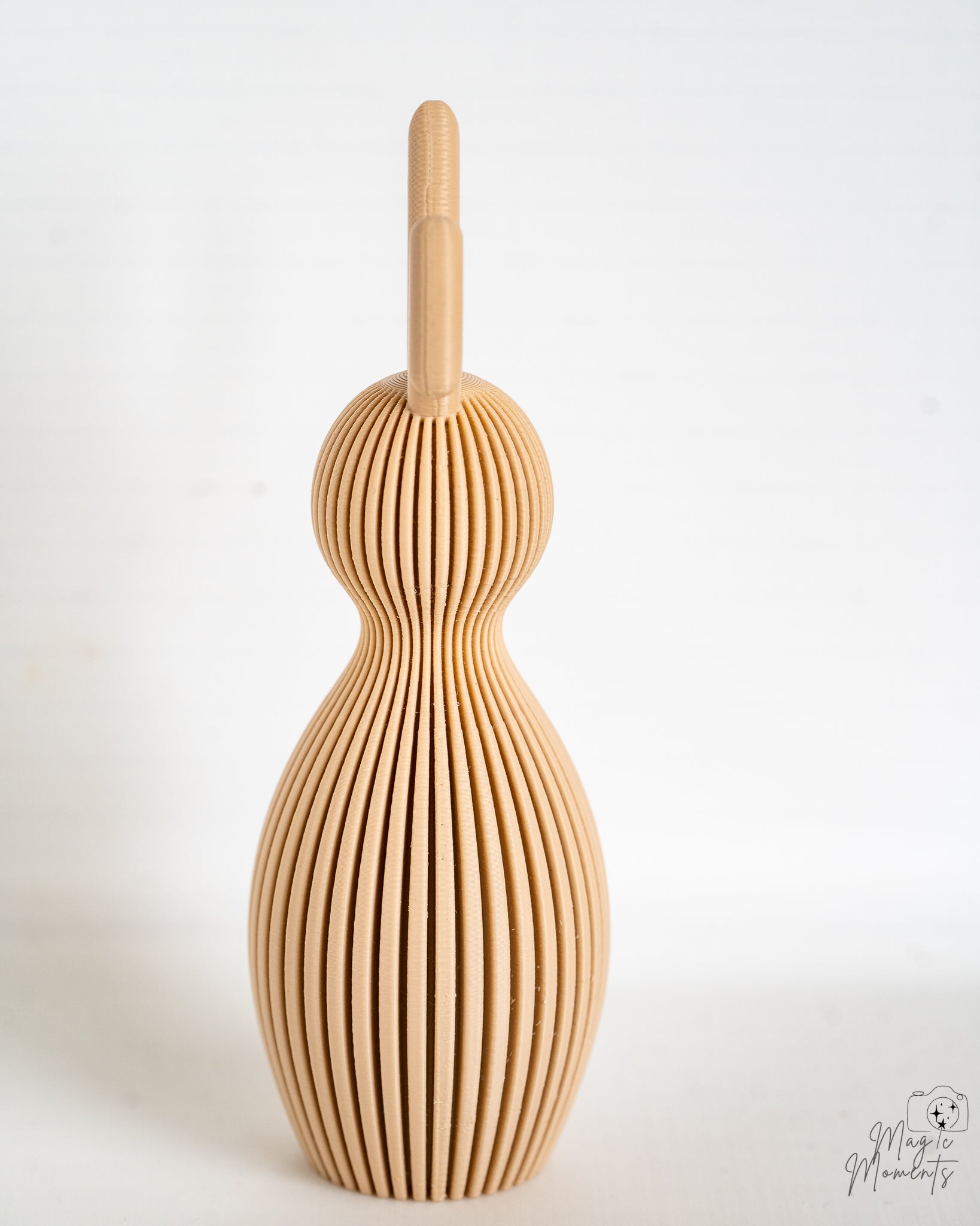 Beige bunny figure viewed from side