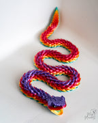 Coiled rainbow articulated snake figure