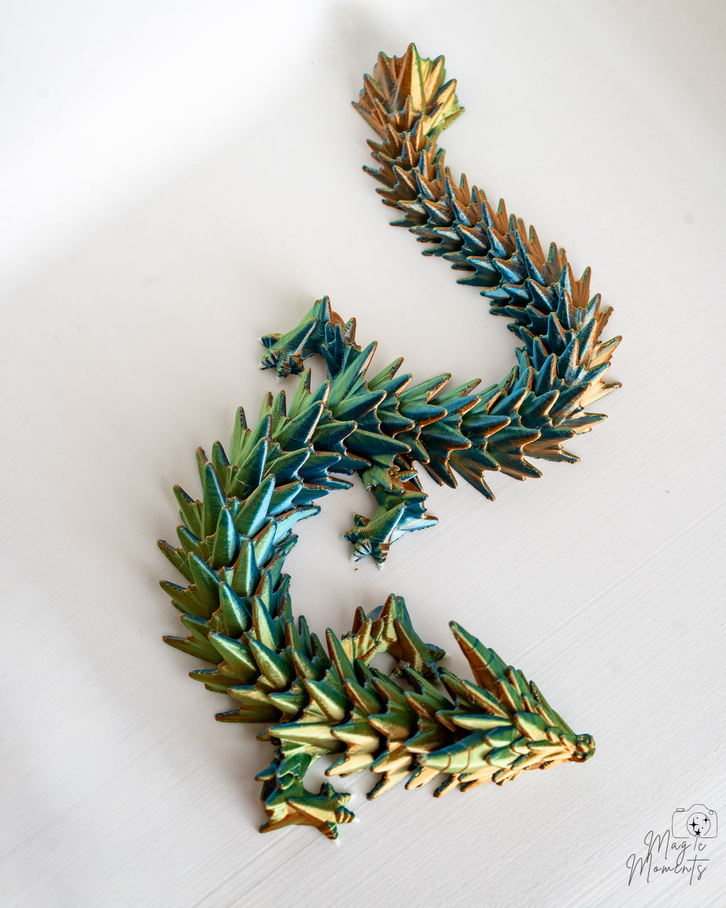 Articulated crystal dragon in blue and gold colours