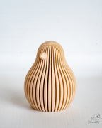 Beige chicken ornament viewed from side