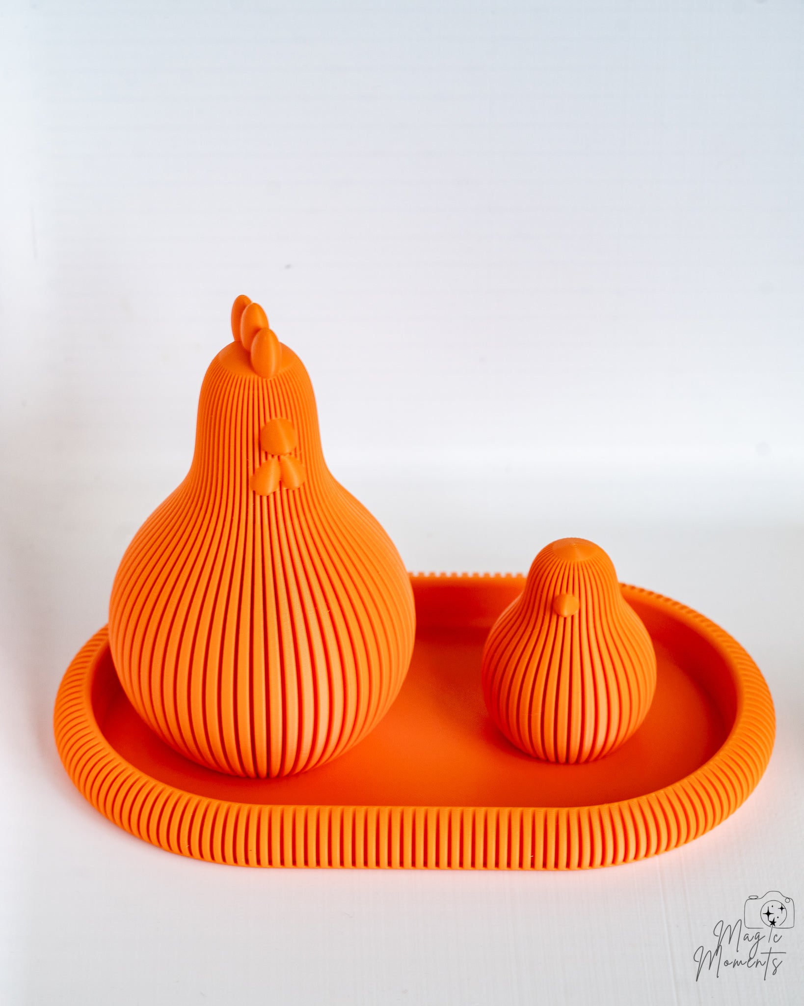 Orange ribbed chicken figures on orange tray