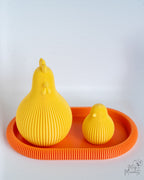Yellow ribbed chicken figures on orange tray