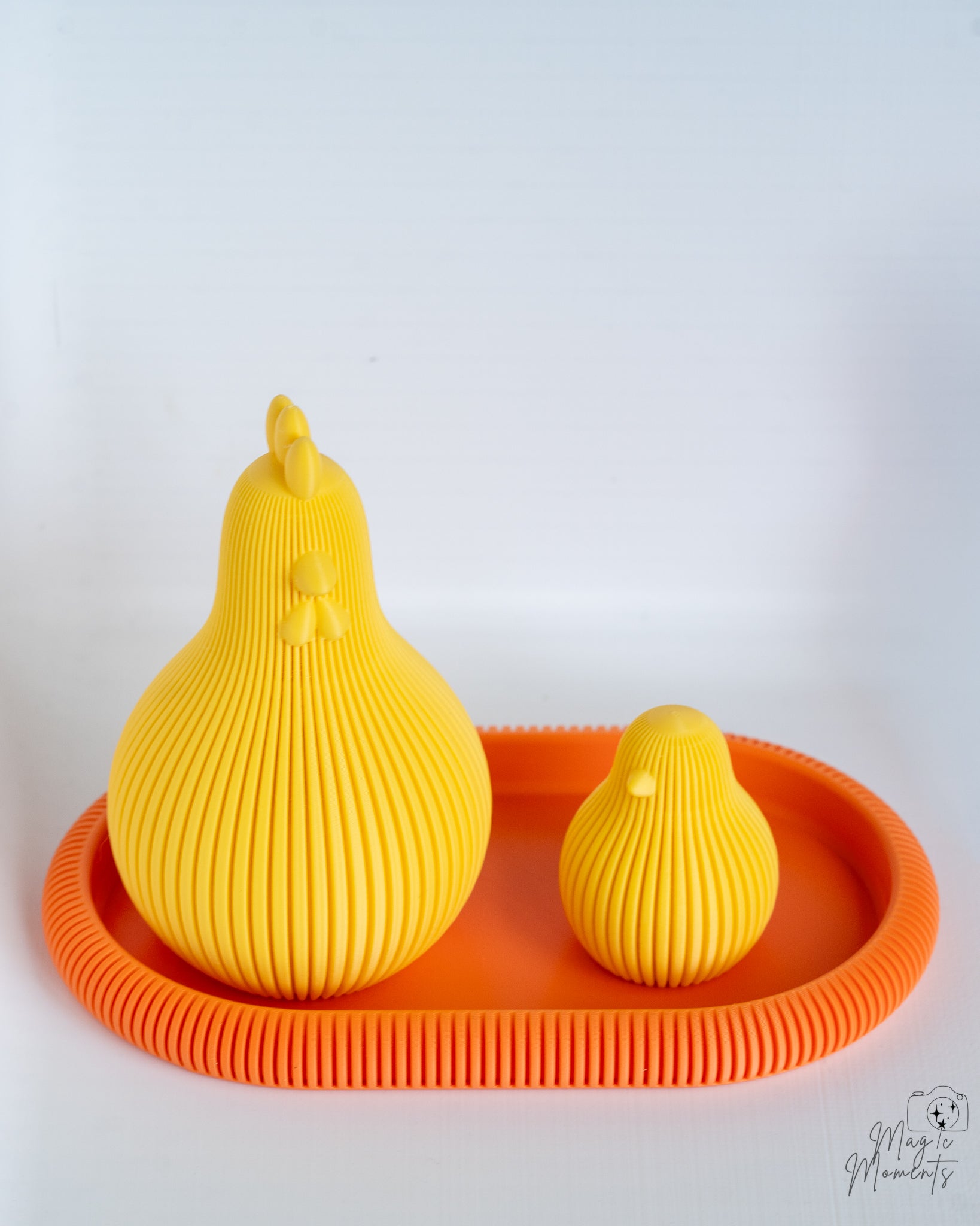 Yellow ribbed chicken figures on orange tray