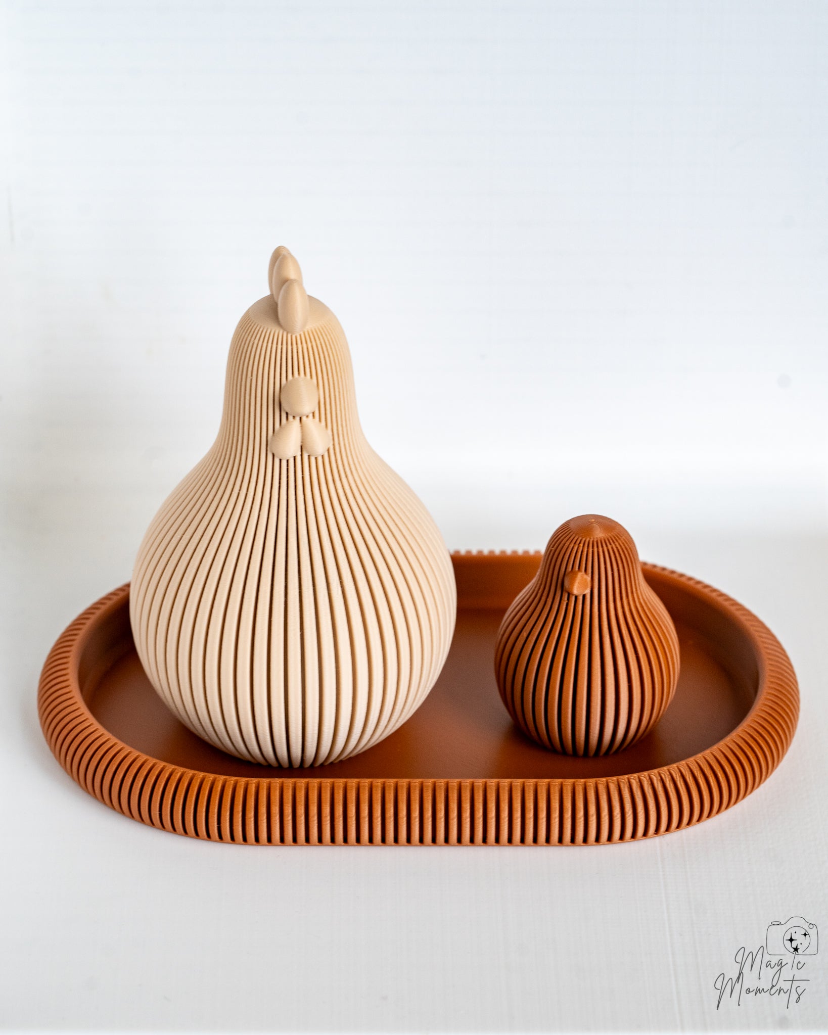 Beige and brown ribbed chicken figures on tray